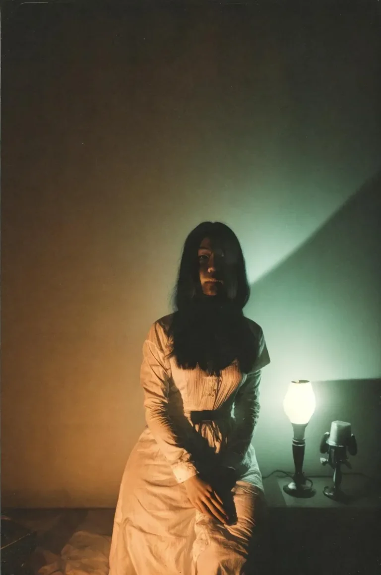 A subtly eerie, AI-generated image of a woman in a Victorian dress illuminated by a dim lamp using Stable Diffusion.