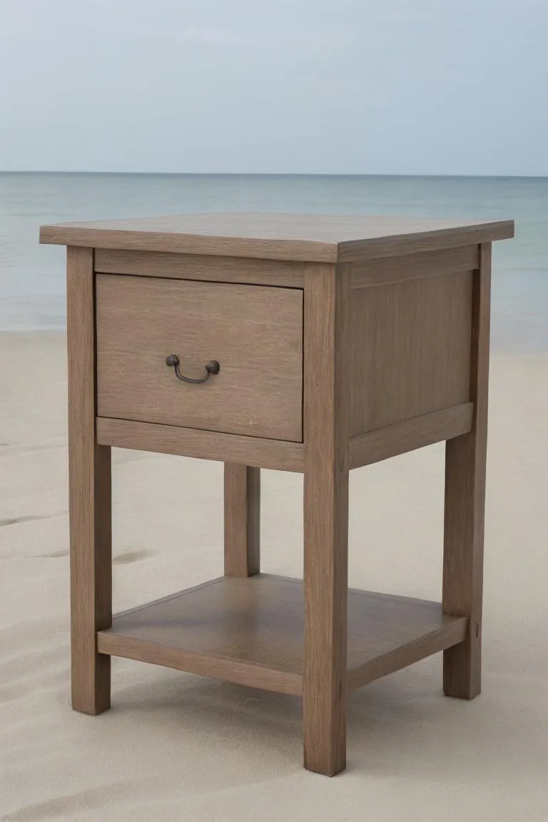 A wooden nightstand with a single drawer and open bottom shelf placed on sandy beach with the ocean in the background, AI generated image using Stable Diffusion.